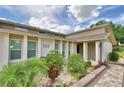 Close-up of a well maintained home featuring mature landscaping and a manicured lawn at 5313 Nichols W Dr, Lakeland, FL 33812