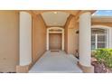 Welcoming front entry with stately columns and a view of the front door at 5548 Woodwind Hills Dr, Lakeland, FL 33812