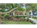 Beautiful home exterior with a well-manicured yard and a welcoming covered porch area at 608 Finney St, Lakeland, FL 33803