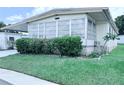 Attractive home with a well-manicured lawn and mature landscaping at 622 Elizabeth Ln, Lakeland, FL 33809