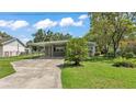 Charming single-story home with a covered carport and well-maintained front lawn at 640 Forrest Dr, Bartow, FL 33830