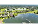 Picturesque aerial view of the community, showcasing lakes, golf courses, and lush greenery at 6964 Lake Eaglebrooke Dr, Lakeland, FL 33813