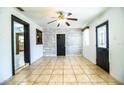 The light and airy living room showcases the hardwood floors and updated ceiling fan at 1720 Park Dr, Lakeland, FL 33803
