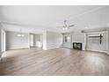 Spacious living room with modern flooring, neutral paint, and fireplace feature at 2055 S Floral Ave # 245, Bartow, FL 33830