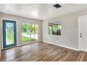 This living room features hardwood floors, natural light, and neutral paint at 215 W Valencia St, Lakeland, FL 33805