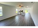 Expansive living room featuring a kitchen with modern appliances and a center island at 2521 Sunset Dr, Winter Haven, FL 33881