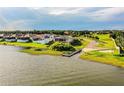 Waterfront property featuring a private dock and lakeside access with a residential home at 4222 Juliana Lake Dr, Auburndale, FL 33823