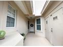 Charming entryway featuring neutral colors, a decorative wreath, and bright natural light at 443 Enclave Pl # 0, Lakeland, FL 33803