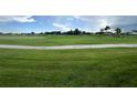 Scenic view of the community golf course with rolling green fairways and mature trees at 443 Enclave Pl # 0, Lakeland, FL 33803