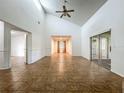 Spacious living room with vaulted ceilings and tile floors, bathed in natural light at 4720 Wildflower Dr Dr, Lakeland, FL 33811