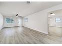 Bright living room with new floors, fresh paint, a ceiling fan, and lots of natural light at 508 Boger N Blvd, Lakeland, FL 33803