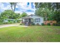 Charming single story home with well-manicured lawn at 615 N Church Ave, Fort Meade, FL 33841