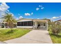 Charming single Gathering home with carport, well maintained lawn and colorful bushes at 6443 Hollyberry Ne Ln, Winter Haven, FL 33881