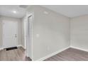 Inviting entryway featuring modern flooring, fresh paint, and ample closet space at 1025 Lakewood Ct, Lakeland, FL 33801