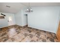 Bright living space with stylish tile flooring and ample natural light at 2700 Park Ave, Indian Lake Estates, FL 33855