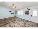 Inviting living room features large windows and decorative accents at 2700 Park Ave, Indian Lake Estates, FL 33855