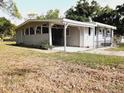 House exterior showcasing carport at 313 S Ridgewood Ave, Deland, FL 32720