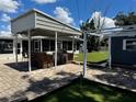 This home features an outdoor kitchen and a mini golf area for entertaining at 508 Garden N Dr, Lakeland, FL 33813