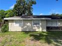 This home features a well-kept lawn, neutral siding, and bright windows at 105 Byron Pl, Winter Haven, FL 33884