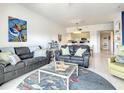 Spacious living room featuring comfortable seating and coastal decor at 5300 S Atlantic Ave # 6-505, New Smyrna Beach, FL 32169