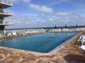 Refreshing community pool with ample deck space for lounging at 4811 Saxon # A201, New Smyrna Beach, FL 32169