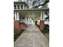 Long front porch with brick pillars and a walkway at 214 S Riverside Dr, New Smyrna Beach, FL 32168