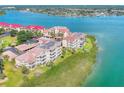 Aerial view of waterfront condo community with lush landscaping at 434 Bouchelle Dr # 304, New Smyrna Beach, FL 32169