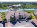 Aerial view of waterfront condo building with parking and boat slips at 434 Bouchelle Dr # 304, New Smyrna Beach, FL 32169