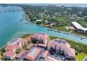 Aerial view of waterfront condo community near bridge and waterway at 434 Bouchelle Dr # 304, New Smyrna Beach, FL 32169