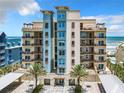 Beautiful multi-story beachfront condo building featuring private balconies and well-manicured landscaping at 807 S Atlantic Ave # 302, New Smyrna Beach, FL 32169