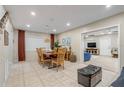 Bright dining room with wood table and chairs, view into living room at 3509 S Atlantic Ave # 400, New Smyrna Beach, FL 32169