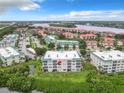 Stunning aerial view of condominium buildings with well-manicured landscaping and beautiful water views at 426 Bouchelle Dr # 303, New Smyrna Beach, FL 32169