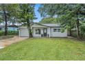 Newly renovated home with a modern facade and well-manicured lawn at 798 E 11Th Ave, New Smyrna Beach, FL 32169