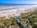 Elevated boardwalk provides an easy, scenic path to the beach at 253 Minorca Beach Way # 205, New Smyrna Beach, FL 32169