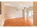 Spacious living room featuring vaulted ceilings, beautiful flooring, and natural light at 6793 Calistoga Cir, Port Orange, FL 32128