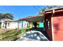 Covered patio, detached garage, and fenced backyard at 131 W Palm Way, Edgewater, FL 32132