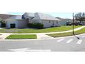 Pleasant home exterior featuring landscaped lawn, tidy shrubbery, and inviting curb appeal at 537 Coral Trace Blvd, Edgewater, FL 32132
