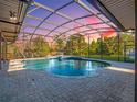 Inviting screened pool and patio area at 335 Woodridge Dr, Geneva, FL 32732