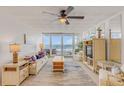 Bright living room with ocean view and comfy seating at 5203 S Atlantic Ave # 814B, New Smyrna Beach, FL 32169