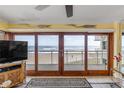 Balcony view of the ocean, beach, and a nearby building from a condo at 4811 Saxon Dr # C102, New Smyrna Beach, FL 32169