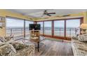 Comfortable living room with ocean view from balcony, tropical decor at 4811 Saxon Dr # C102, New Smyrna Beach, FL 32169