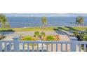 Beautiful water view with lush greenery, showcasing the home's serene setting and landscaped yard at 4946 Halifax Dr, Port Orange, FL 32127