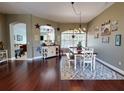 Bright dining room with hardwood floors and farmhouse style decor at 6812 Stoneheath Ln, Port Orange, FL 32128