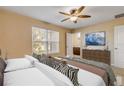 Spacious bedroom with ensuite bathroom and large window at 104 Kelly Thomas Way, Daytona Beach, FL 32124