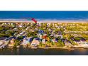 Aerial view of a home near the beach with water access at 1324 N Peninsula Ave, New Smyrna Beach, FL 32169