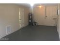 Spacious basement offering potential for storage or customization with a clean, painted floor at 1500 Wildrose Ln, Daytona Beach, FL 32117