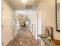 View through the entryway to living room with tile flooring at 1846 Turnbull Lakes Dr, New Smyrna Beach, FL 32168