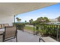 Balcony with patio furniture and ocean view at 3001 S Atlantic Ave # 503, New Smyrna Beach, FL 32169