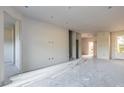 Unfinished living area with stairs and recessed lighting at 3046 Isles Way, New Smyrna Beach, FL 32168