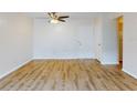 Bright living room with light walls, wood-look floors, and ceiling fan at 3800 Saxon Dr # 39039C, New Smyrna Beach, FL 32169